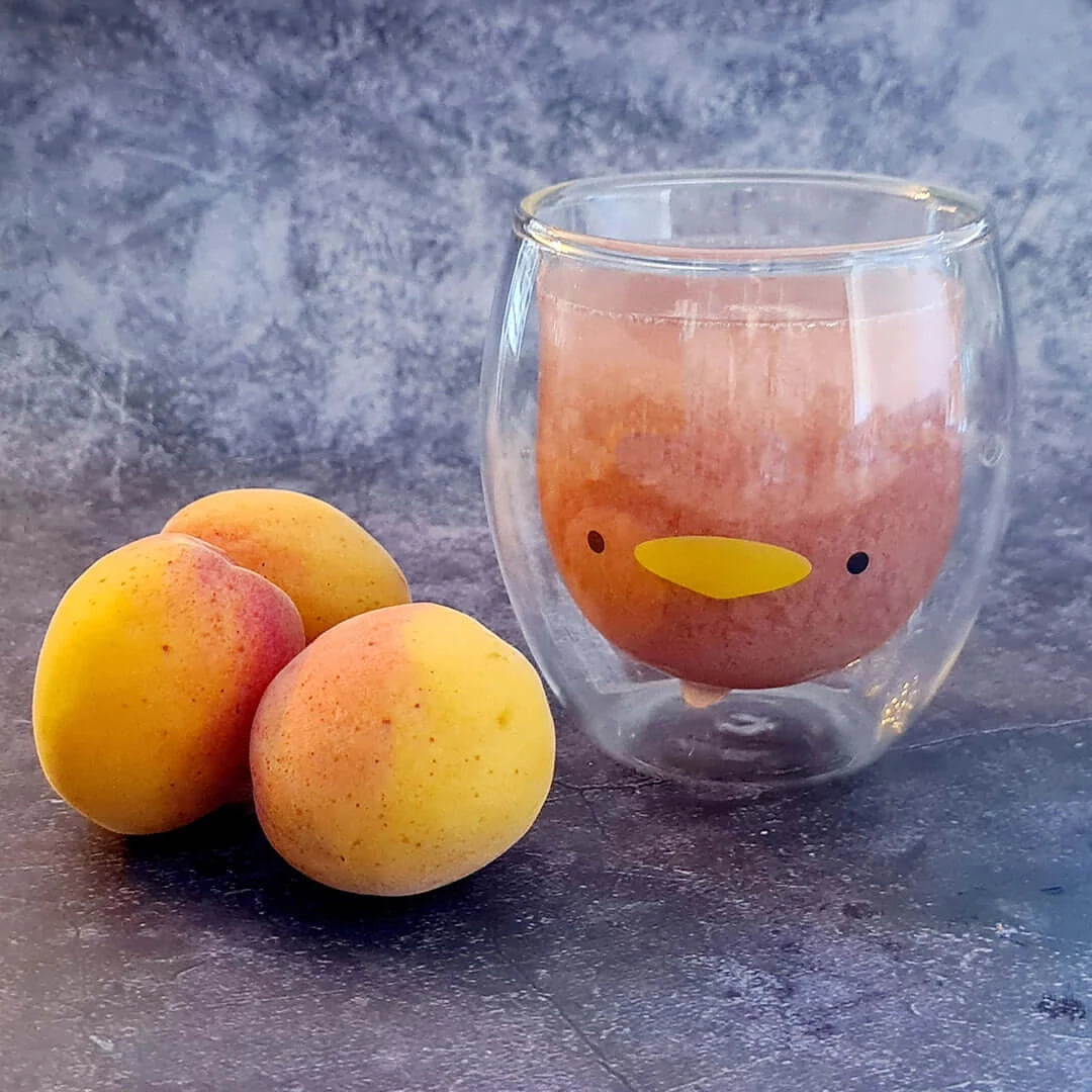 tasse en verre double paroi en forme de canard avec abricots